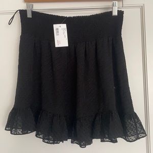 intermix black rena mini skirt size medium. never worn with tags
